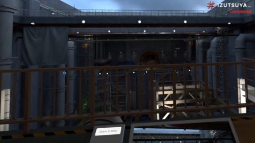 暗い現場を降下するドローン（黄矢印）